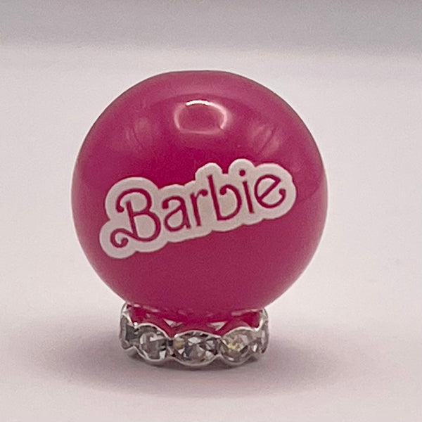 10 Count pink gloss Jellie bead with Bar b!e word in white Vertical